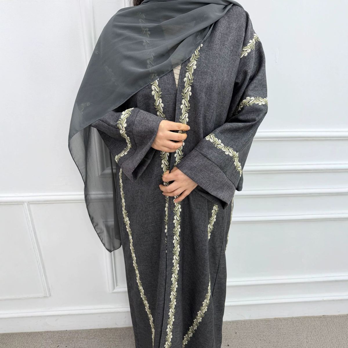 Model in a grey embroidered longline cardigan abaya