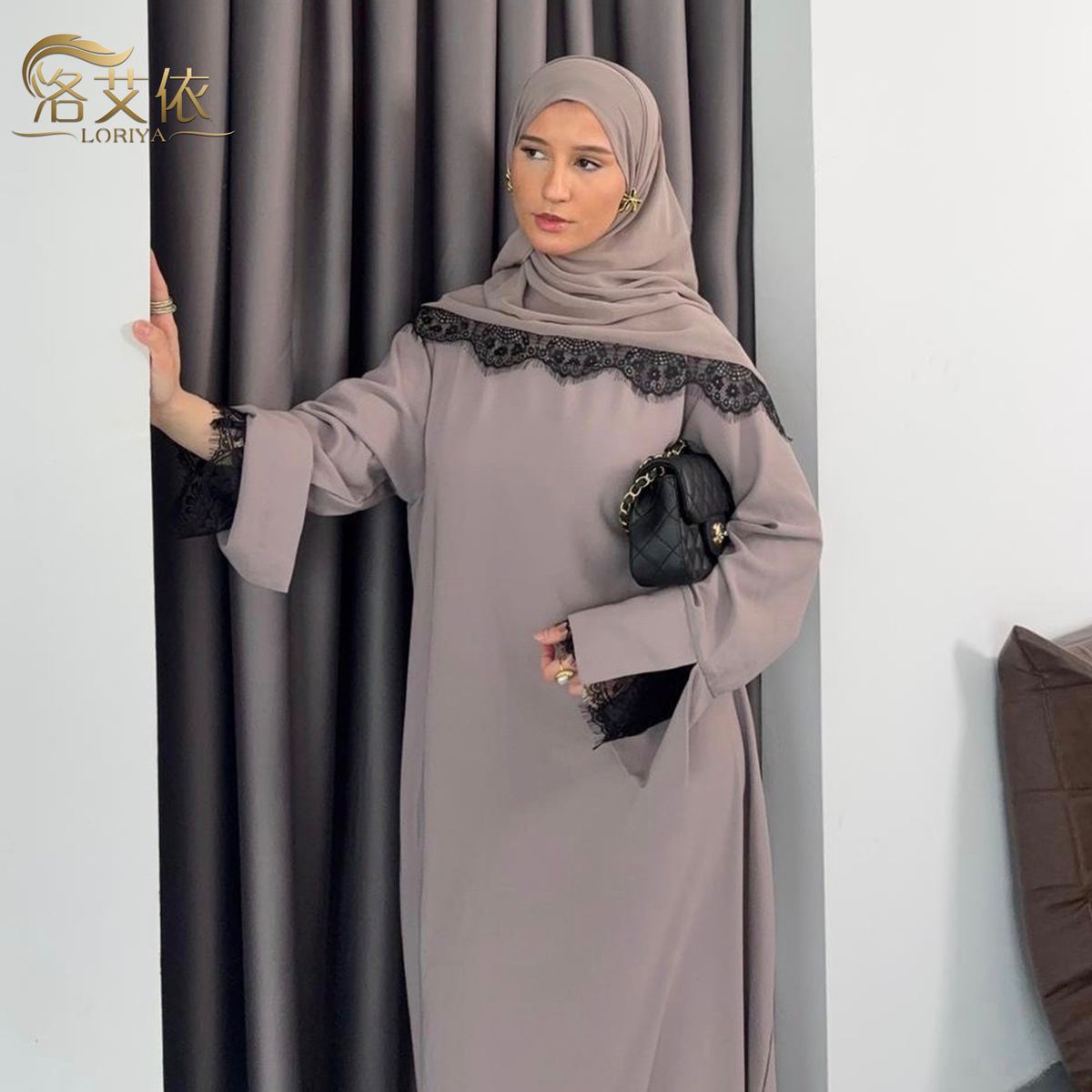 Model in a mauve lace-trimmed maxi dress with matching hijab