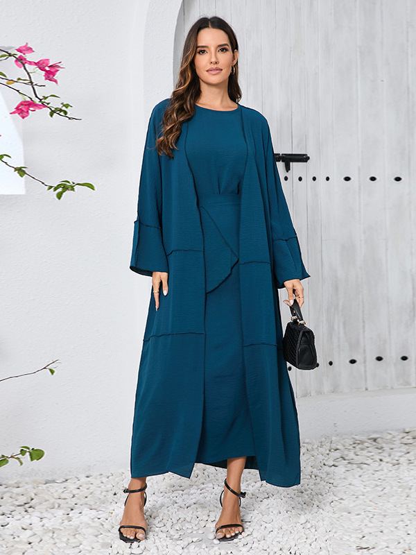 Model in a deep-teal long-sleeve three-piece modest set with long dress