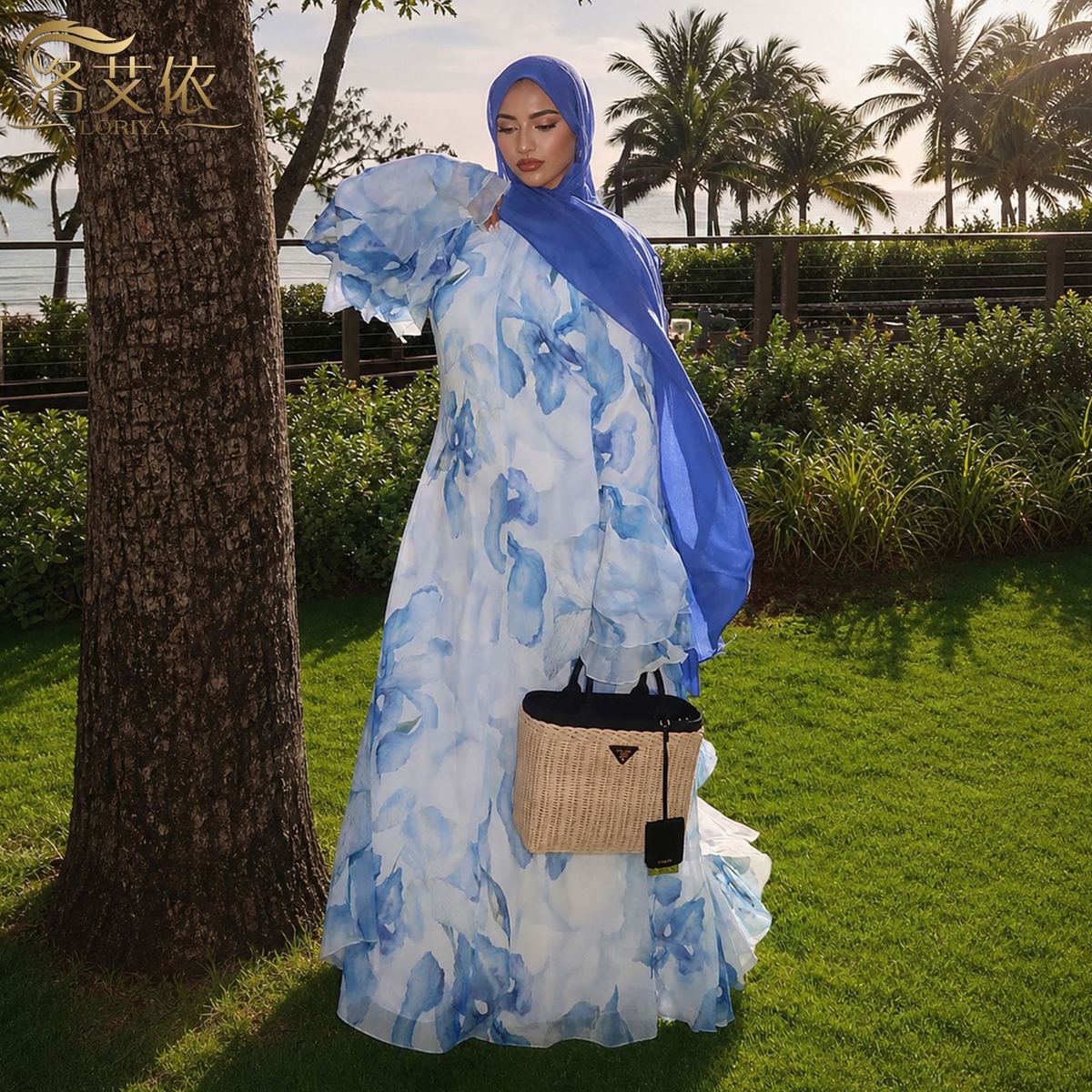 Model in a white printed maxi dress with bell sleeves