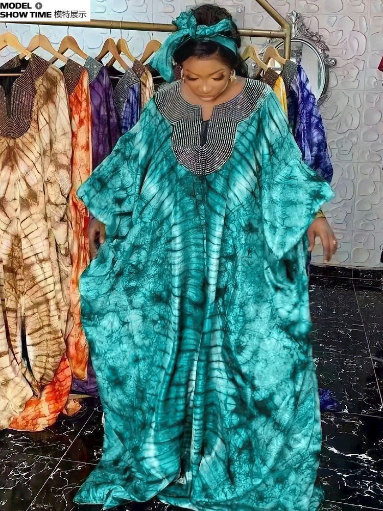 Warm-toned printed African boubou dress with beaded collar and headwrap photo 2